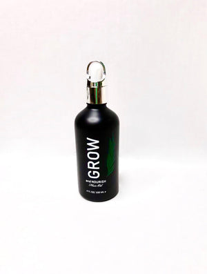Bottle of Grow and Nourish hair oil. Hair growth oil.